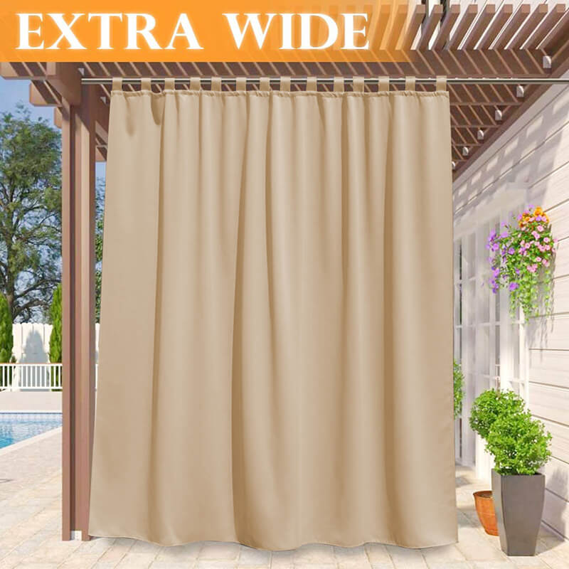 Extra wide beige waterproof tab top outdoor curtain panel on a pergola, providing shade for a porch deck by a pool.