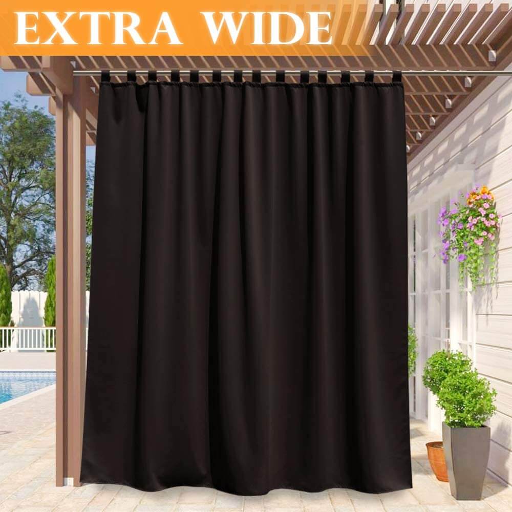 Extra wide black waterproof tab top outdoor curtain on a pergola, providing shade & privacy for a porch deck patio.