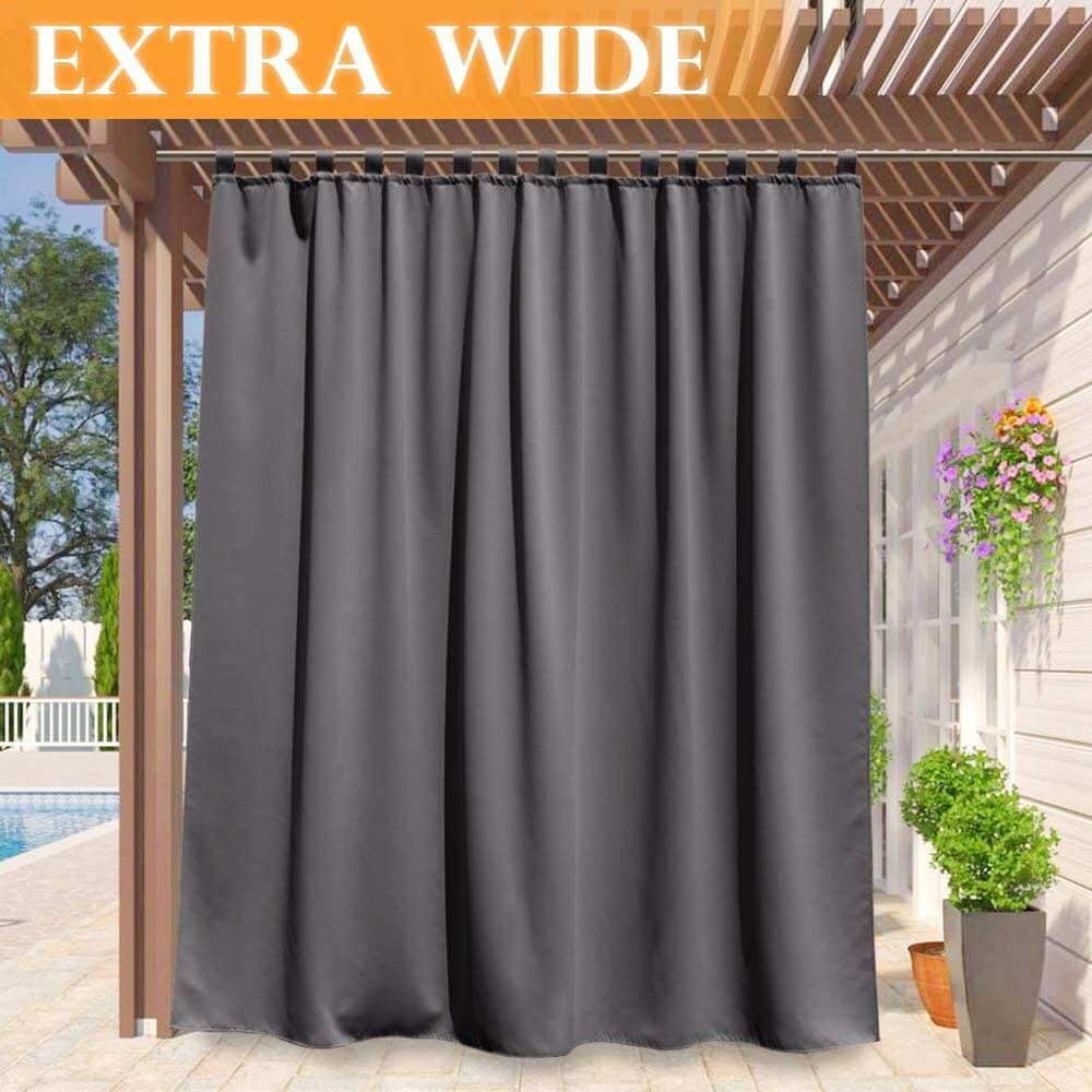 Charcoal grey waterproof tab top outdoor curtain panel on a pergola, providing shade & privacy for a porch deck & pool area.