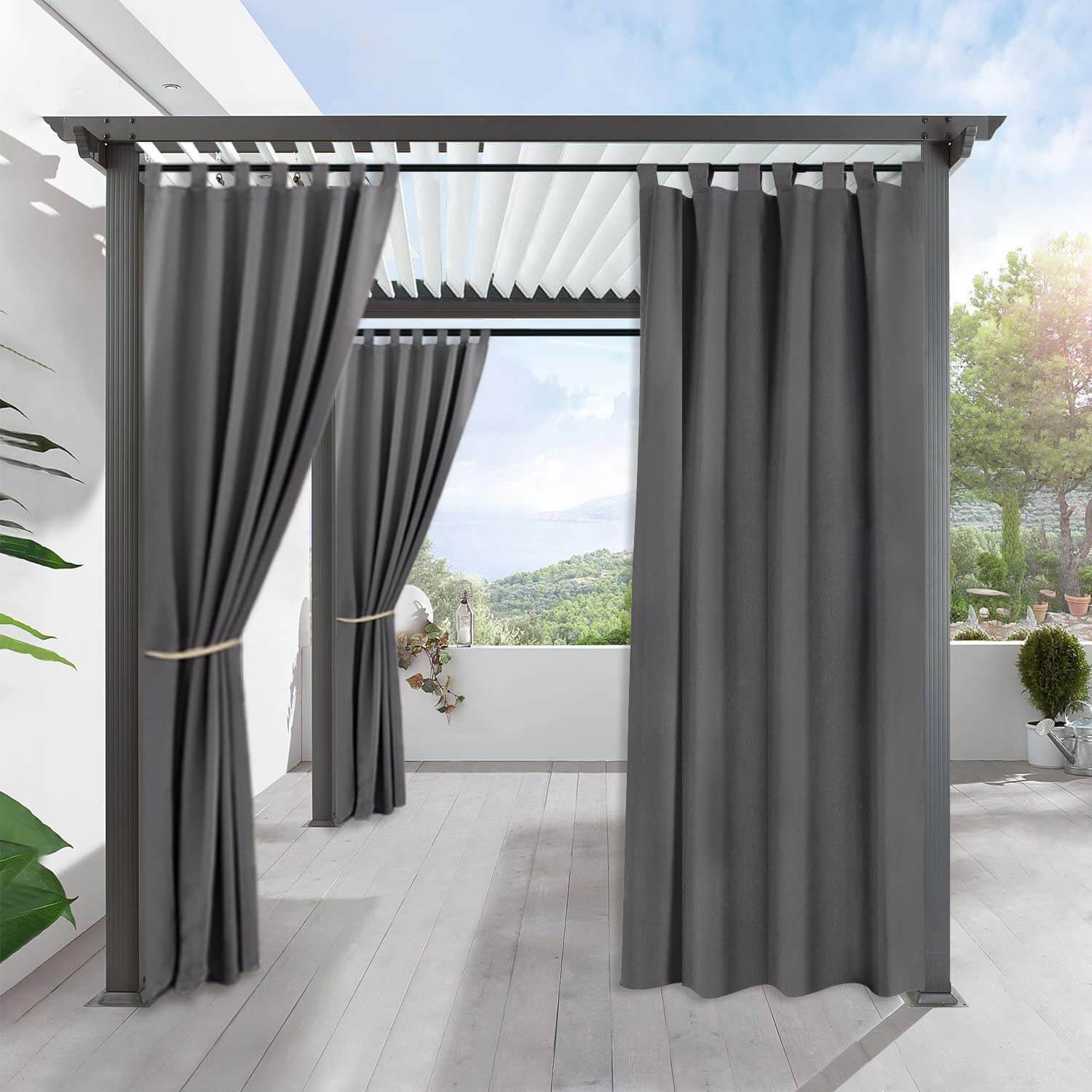 Dark gray waterproof tab top outdoor curtains on a modern patio pergola, providing privacy & shade for a deck or porch.