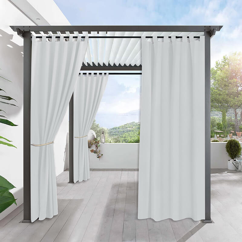 White waterproof tab top outdoor curtains on a pergola for a shaded porch deck, creating a private outdoor oasis.
