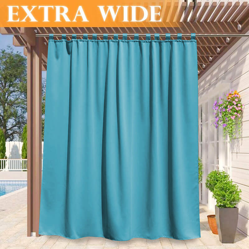 Extra wide turquoise waterproof tab top outdoor curtain panel hangs from a pergola, creating privacy for a poolside patio.