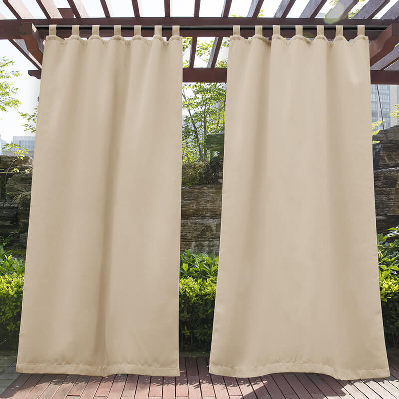 Light beige waterproof tab top outdoor curtains on a wooden pergola, perfect for porch or patio privacy.