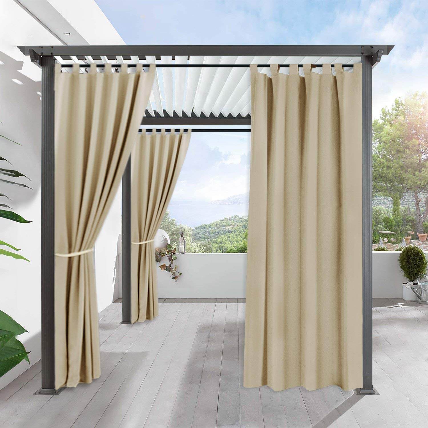 KGORGE beige waterproof tab top outdoor curtains on a pergola, two tied back, one drawn, for porch & deck privacy.