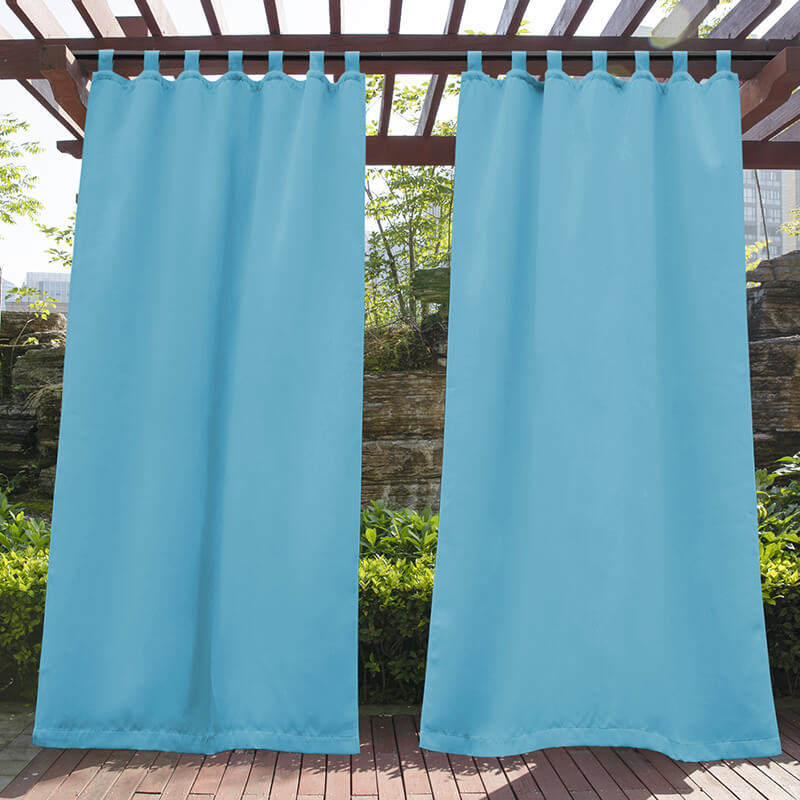 Two teal waterproof tab top outdoor curtains on a wooden pergola, enhancing privacy and shade for a porch or deck outdoor space.