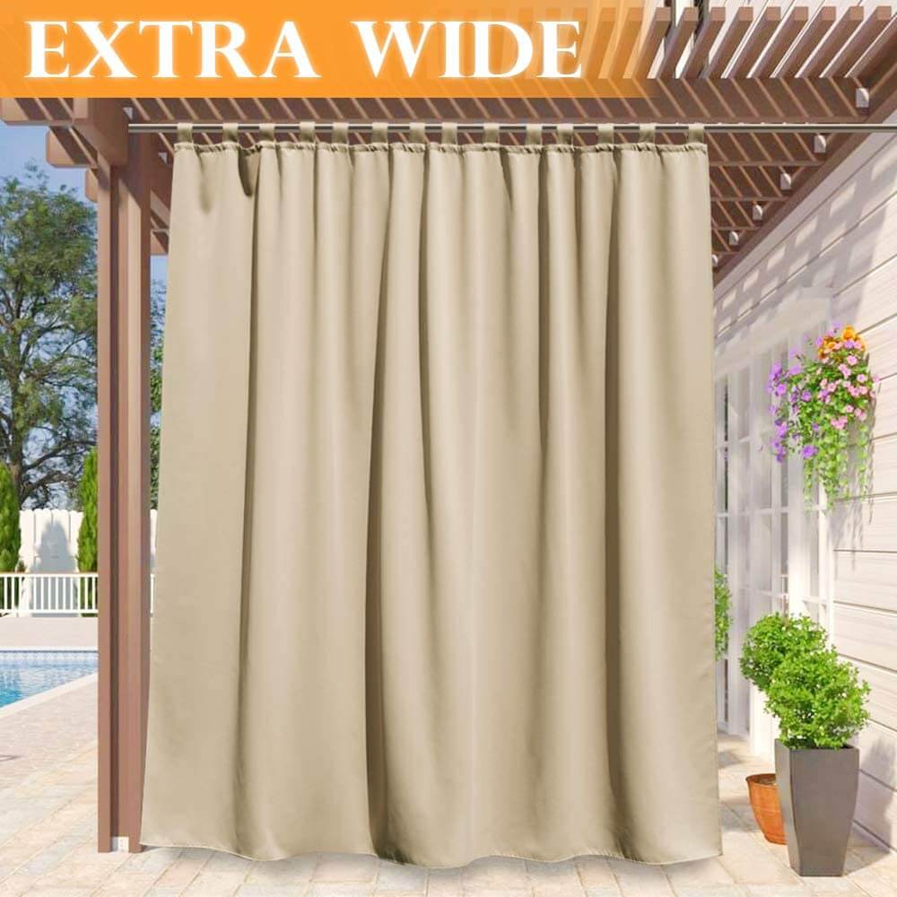 Extra wide beige tab top waterproof outdoor curtain on a pergola, creating shade & privacy for a deck or pool area.