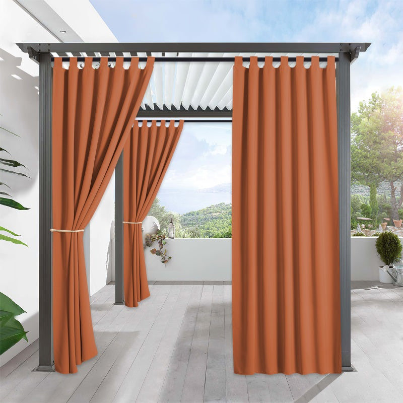 Warm orange waterproof tab top outdoor curtains on a modern pergola, creating privacy for a stylish porch deck living space.