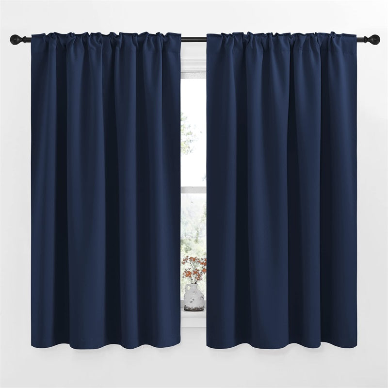 Two navy blue blackout curtain panels with rod pocket & back tab, ideal for living room or bedroom windows.