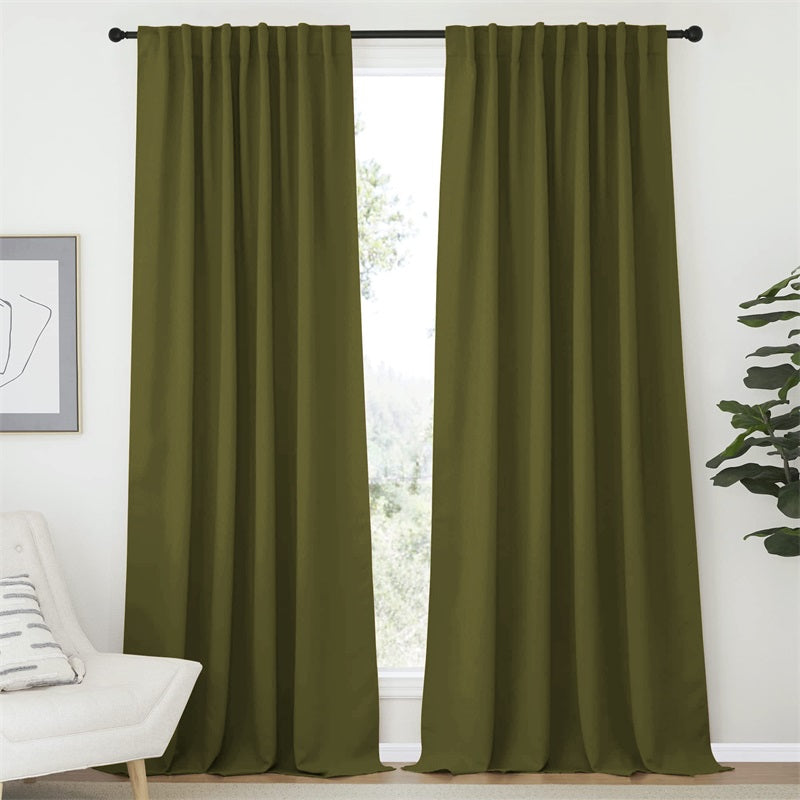 Two olive green Rod Pocket & Back Tab blackout curtain panels, 52 inch wide, hanging in a bright living room window.