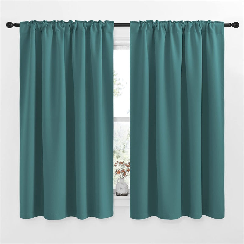 Dark teal rod pocket blackout curtains (2 panels, 52" W) installed in a window, ideal for living room or bedroom privacy.
