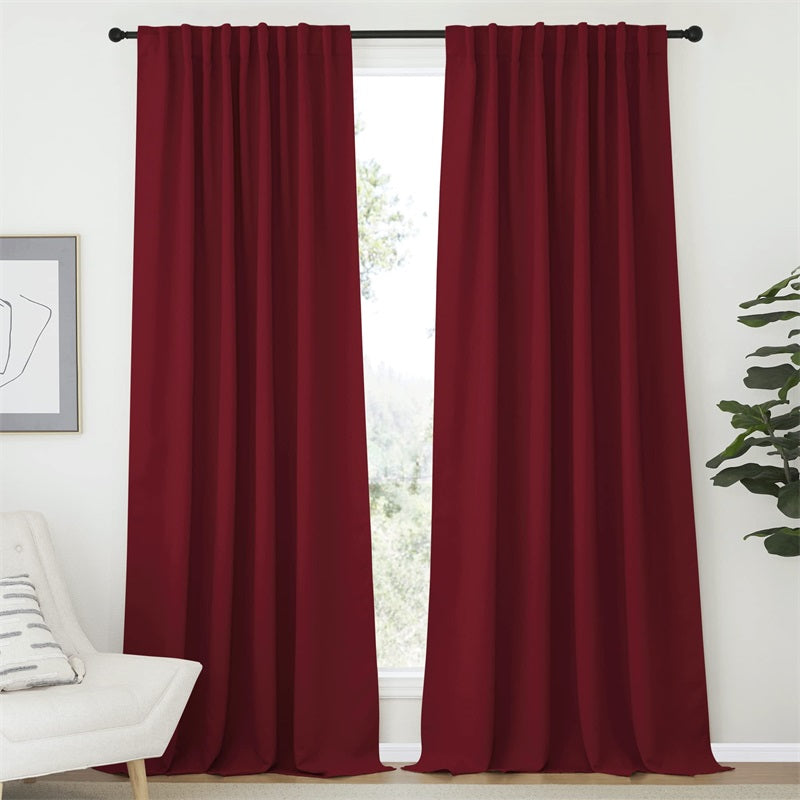 Two deep red 52-inch rod pocket & back tab blackout curtain panels, perfect for living room and bedroom privacy.