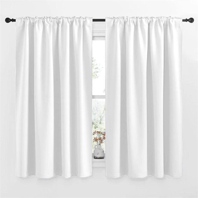 White rod pocket & back tab blackout curtain panels on a black rod, partially covering a window with a vase. Ideal for living room or bedroom.