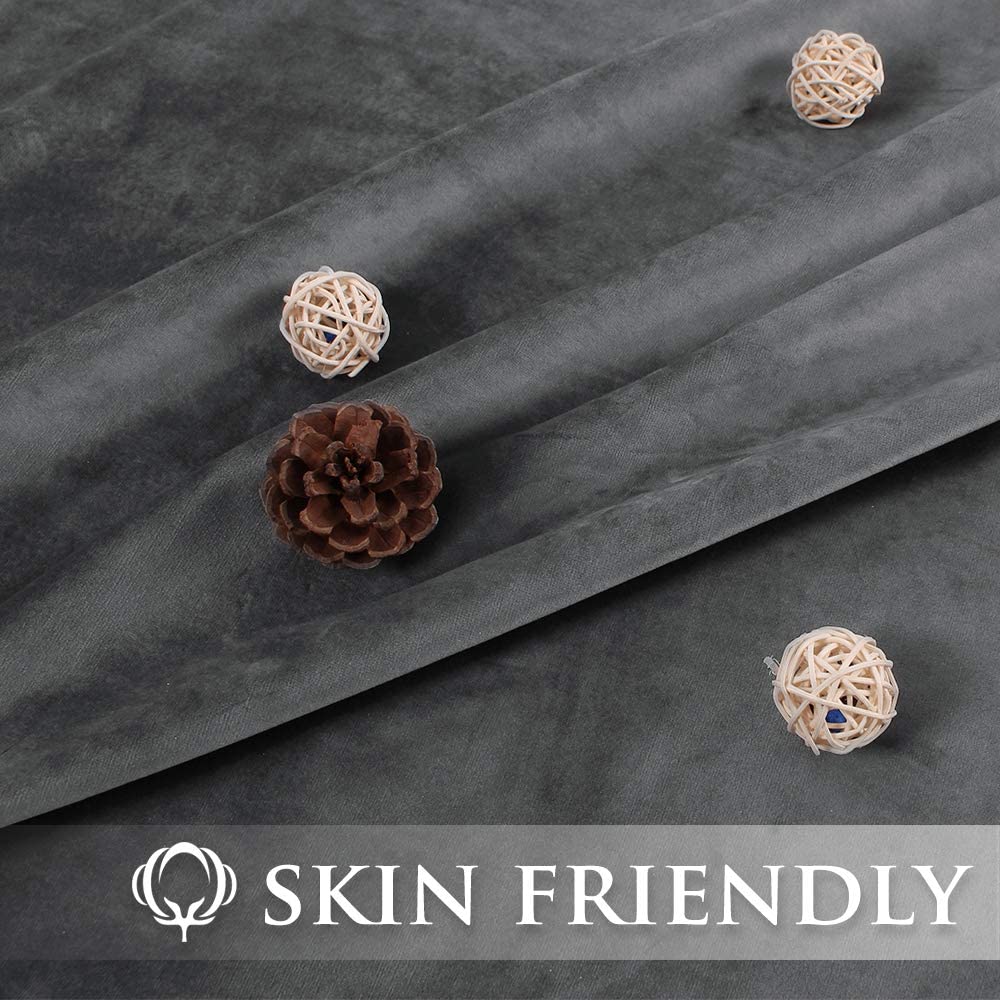 Close-up of luxurious dark grey velvet blackout curtain fabric, accented by decorative elements, featuring a 'Skin Friendly' label.
