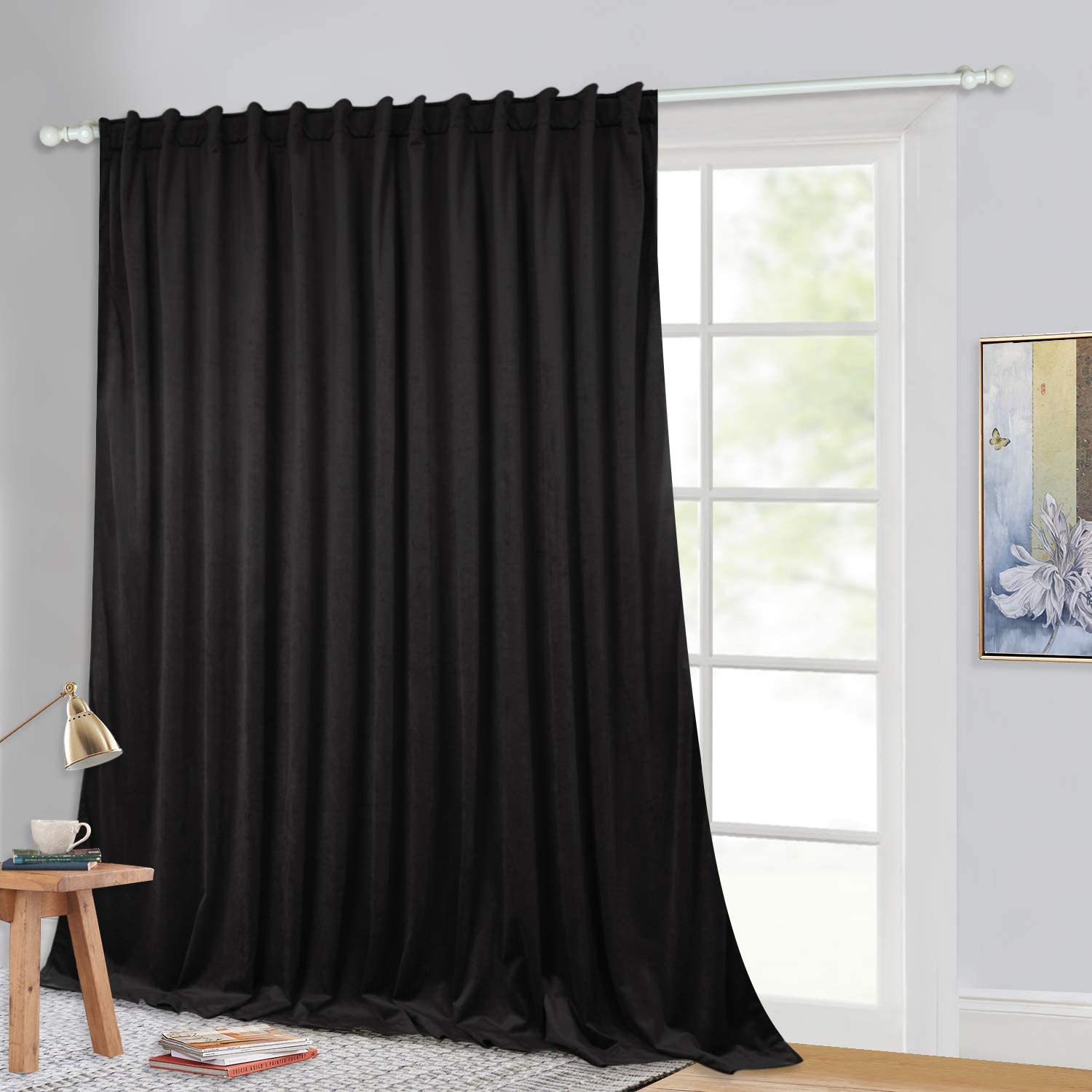 100-inch wide black velvet blackout curtain panel with rod pocket back tab, ideal for living room or bedroom sliding doors.