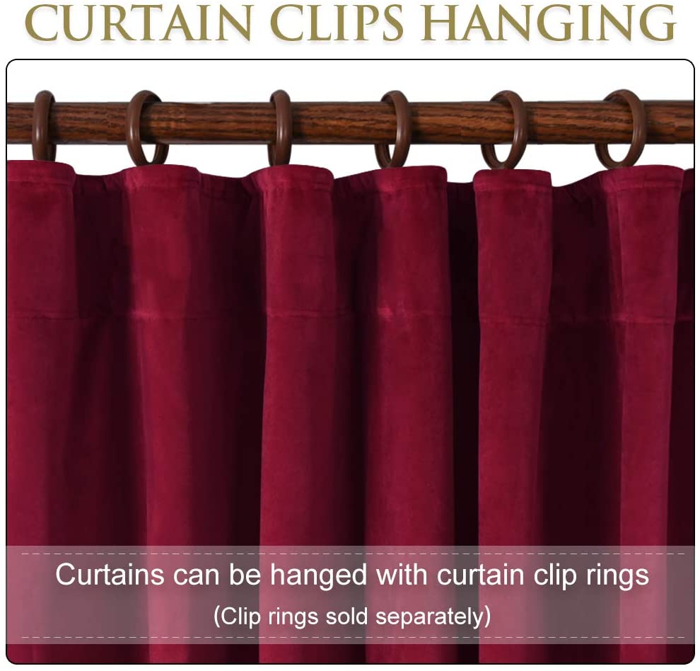 Burgundy velvet blackout curtain detail, hung with brown clip rings on a wooden rod. Versatile for sliding glass door, living room & bedroom.
