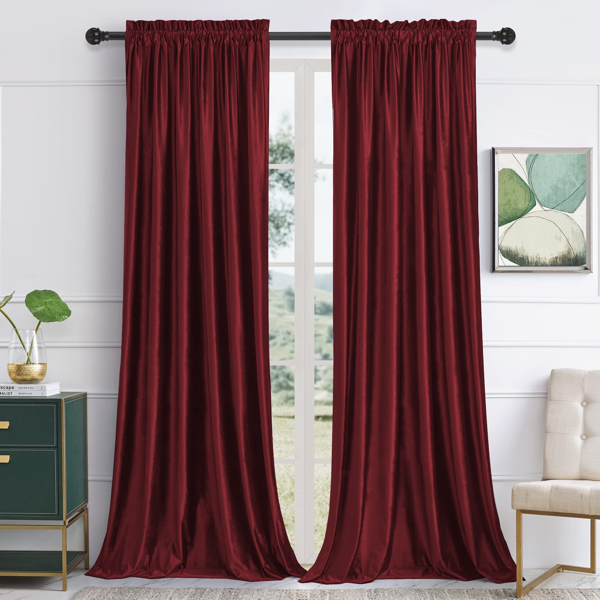 Pair of merlot velvet rod pocket blackout curtains, 2 panels, hanging in a living room, offering noise reduction.