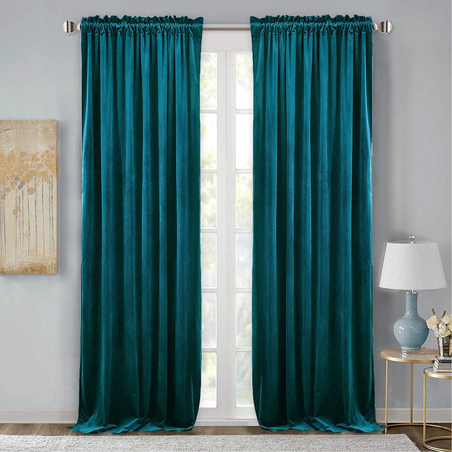 Two elegant teal velvet rod pocket curtains in a living room, providing blackout and noise reducing benefits