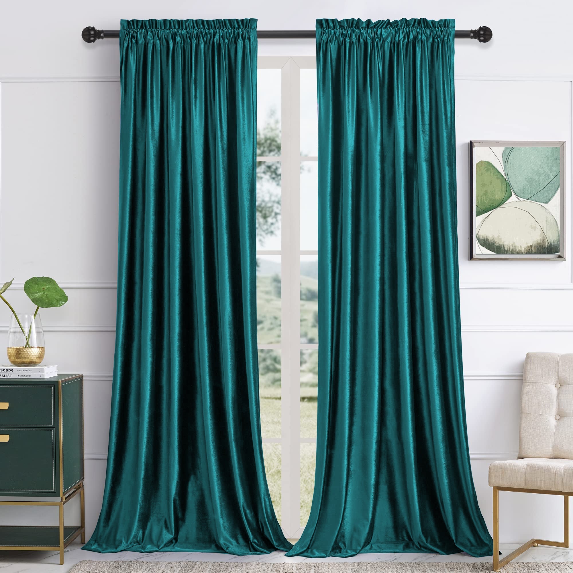 Elegant teal velvet rod pocket curtains for living rooms, featuring noise-reducing blackout fabric, perfectly drapes over a large window.