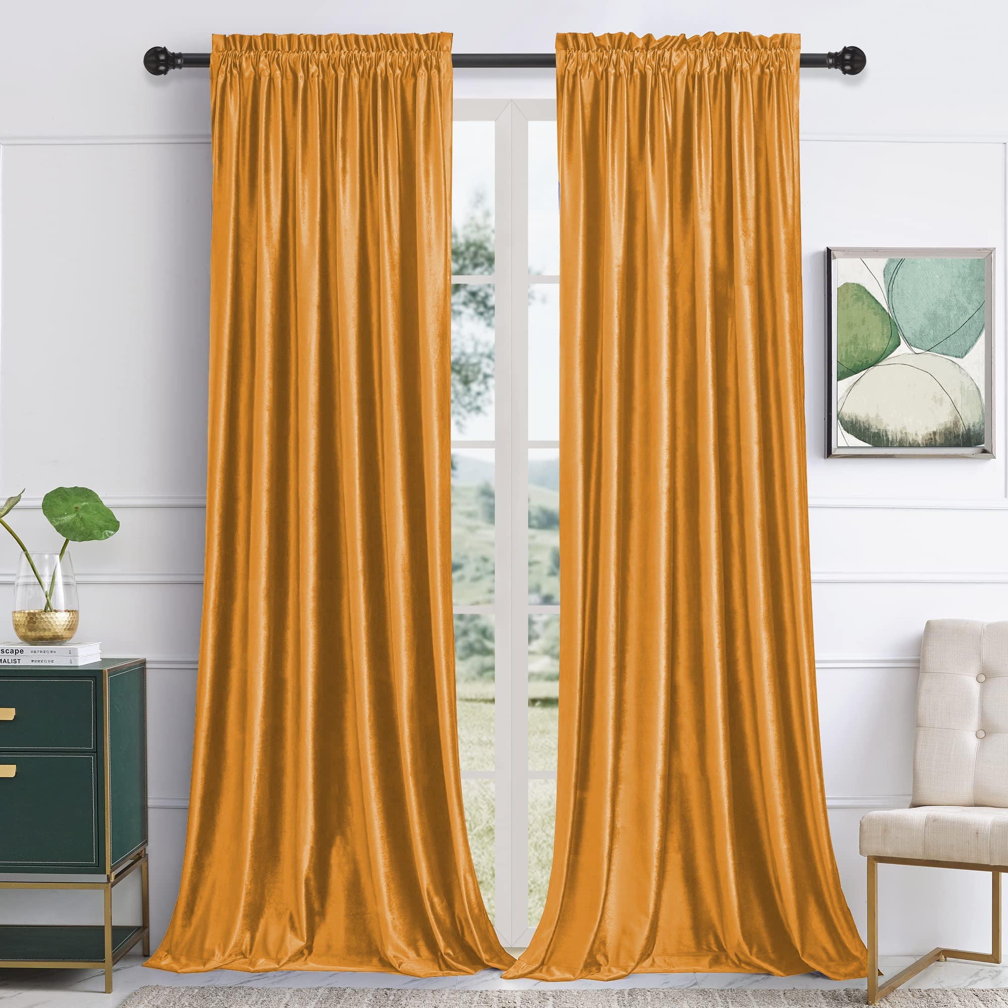 Two panels of luxurious orange velvet rod pocket blackout curtains in a modern living room or bedroom for noise reduction.