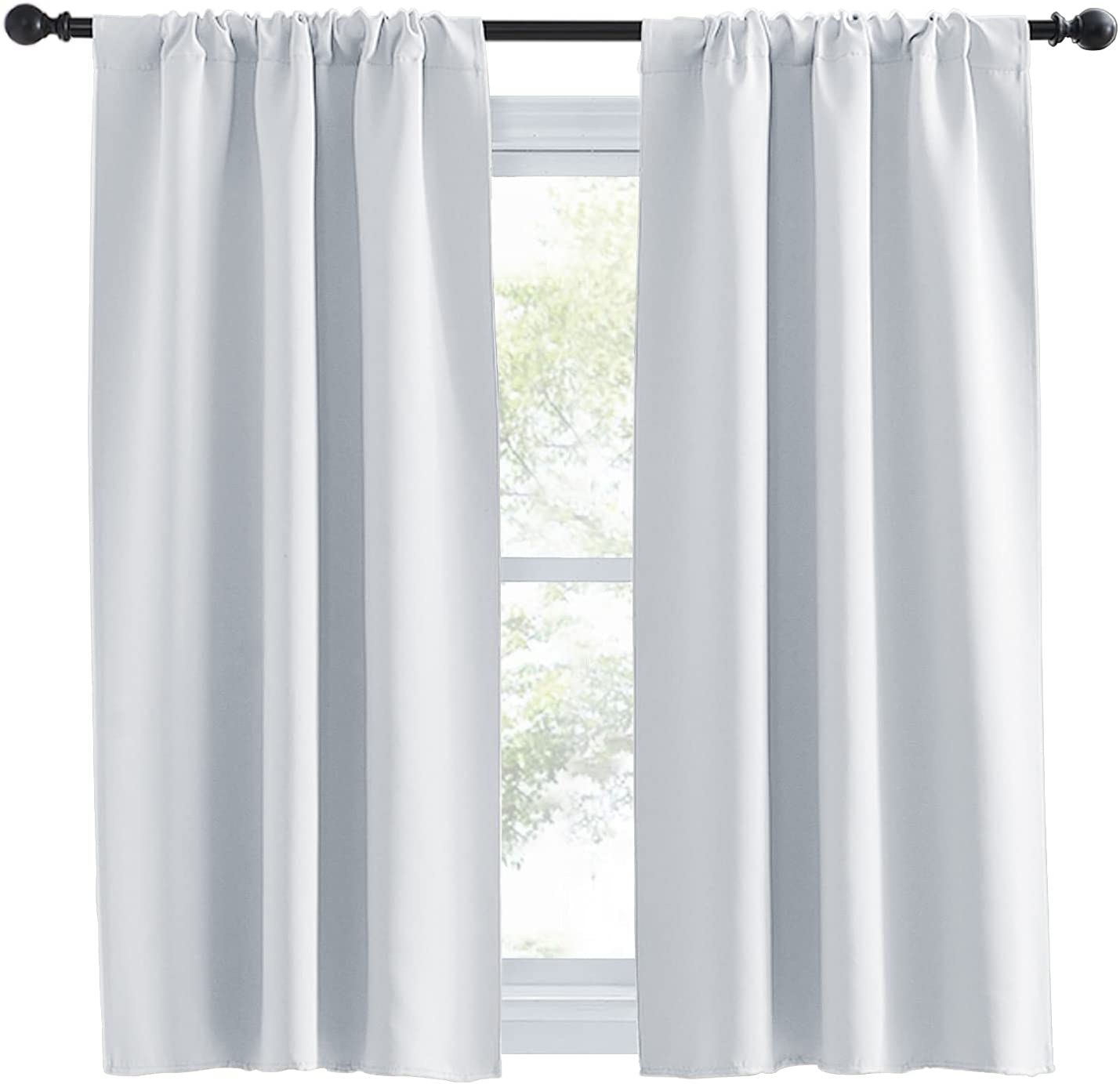 Two light grey rod pocket thermal insulated blackout curtain panels covering a window for living room or bedroom privacy.