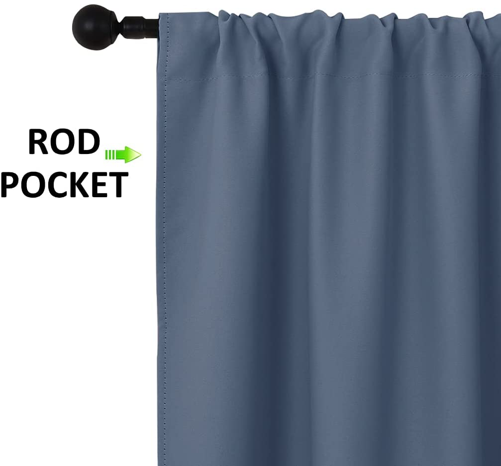 Slate blue thermal insulated blackout curtain panel displaying the rod pocket hanging style on a decorative black rod.