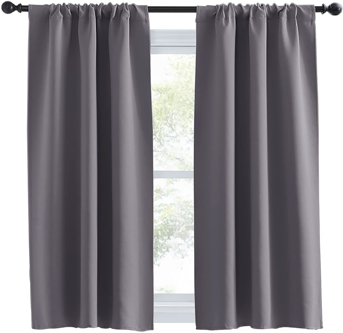 Pair of charcoal grey thermal insulated blackout rod pocket curtain panels on a window rod.