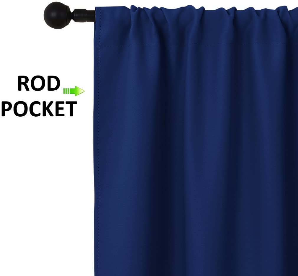 Detailed view of a navy blue rod pocket blackout curtain panel, showcasing the gathered top and triple weave fabric.