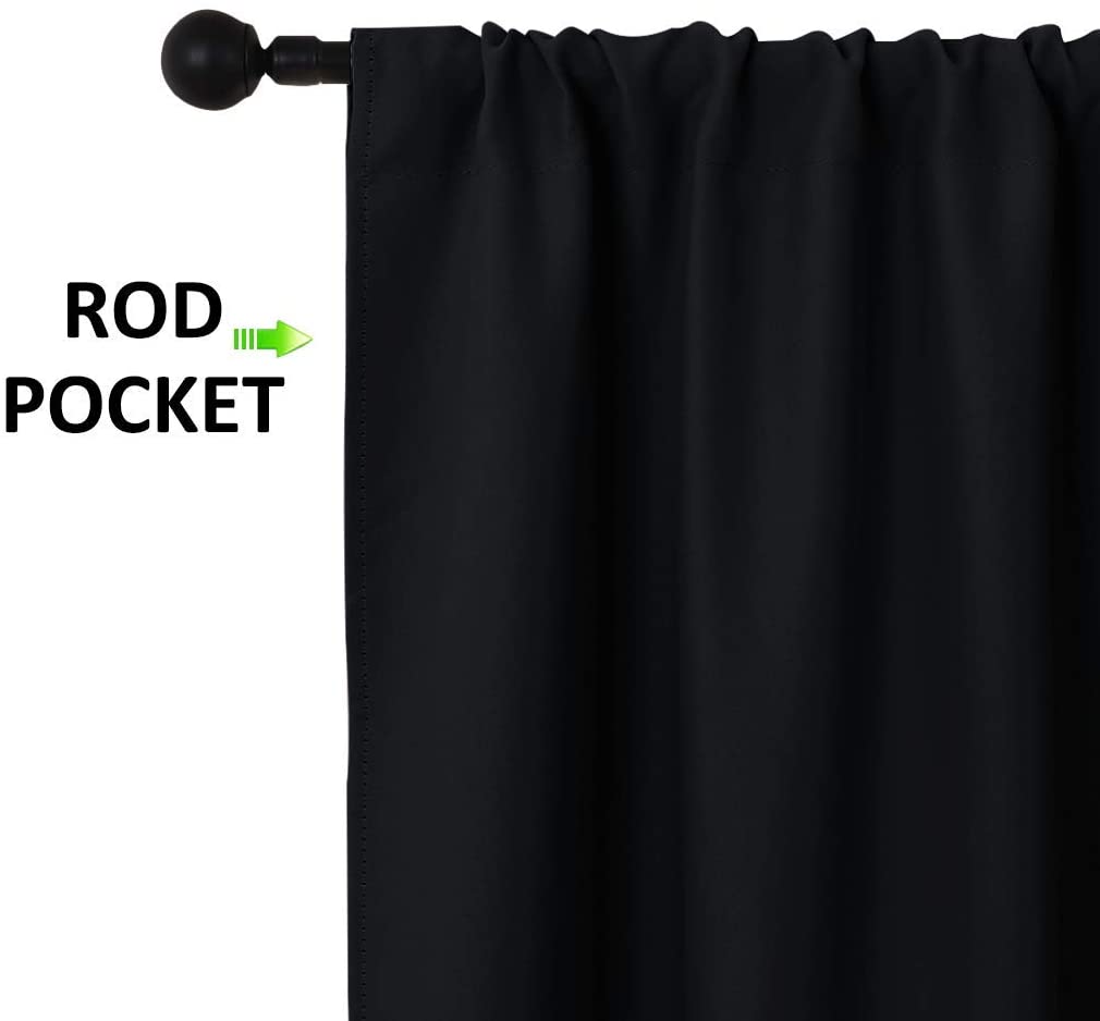 Black rod pocket triple weave blackout curtain panel, showcasing the curtain's heading style on a black rod.