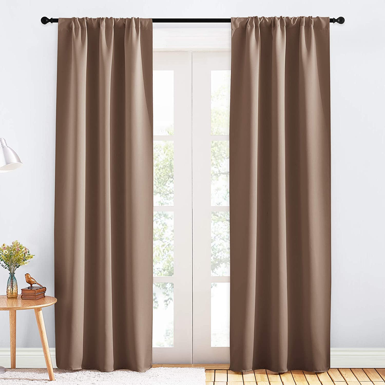 Brown rod pocket triple weave blackout curtains, 2 panels, providing high-performance shade for living room or bedroom.