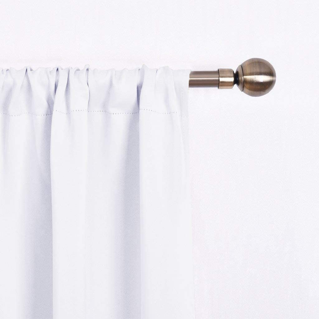 White triple weave rod pocket blackout curtain panel on a bronze decorative curtain rod.