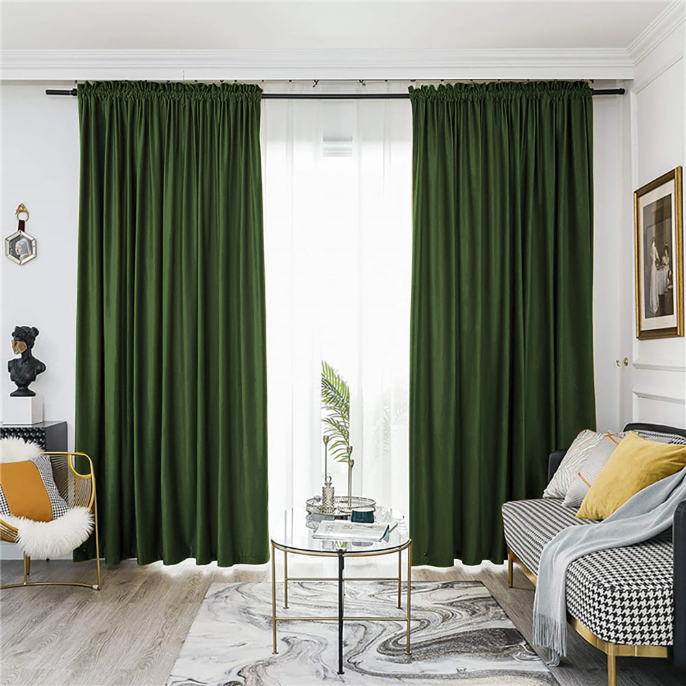 Dark green velvet rod pocket blackout curtains providing room darkening and privacy for a living room.