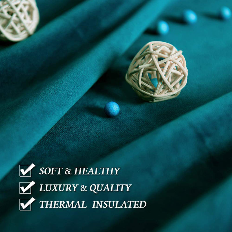 Dark teal velvet fabric close-up, showcasing its soft, luxurious, thermal insulated quality for noise reducing blackout curtains.