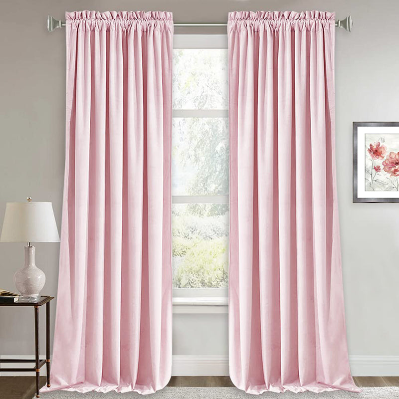 Two pink velvet rod pocket curtains, ideal as noise-reducing blackout drapes for luxury living room or bedroom decor.