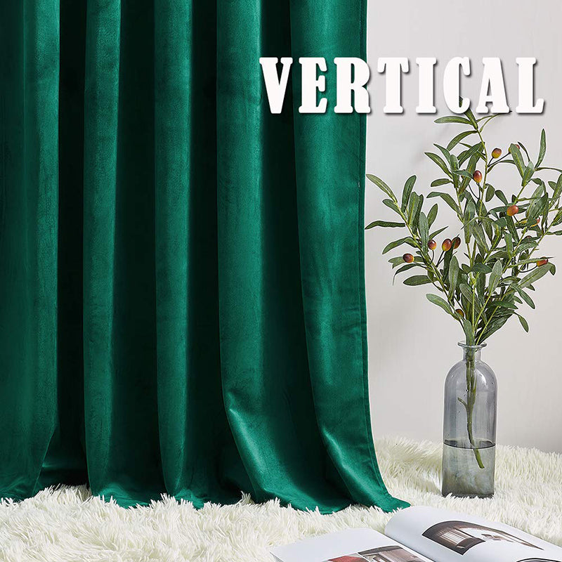 Deep emerald green luxury velvet blackout curtains, showing soft, plush fabric folds on a white rug with a decorative plant.