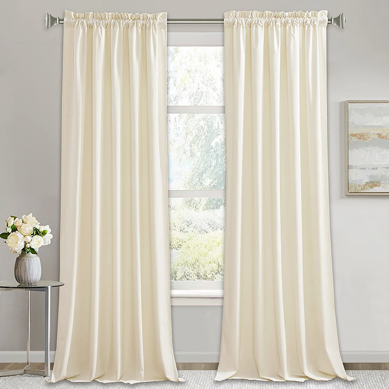 Cream rod pocket velvet noise reducing blackout curtains, two luxury panels, for living room or bedroom privacy.