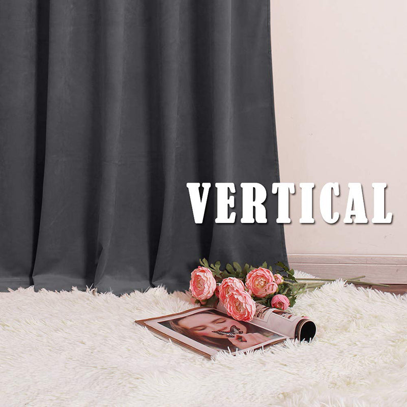 Dark grey rod pocket velvet blackout curtain panel cascading onto a white shaggy rug, ideal for luxury living room and bedroom decor.