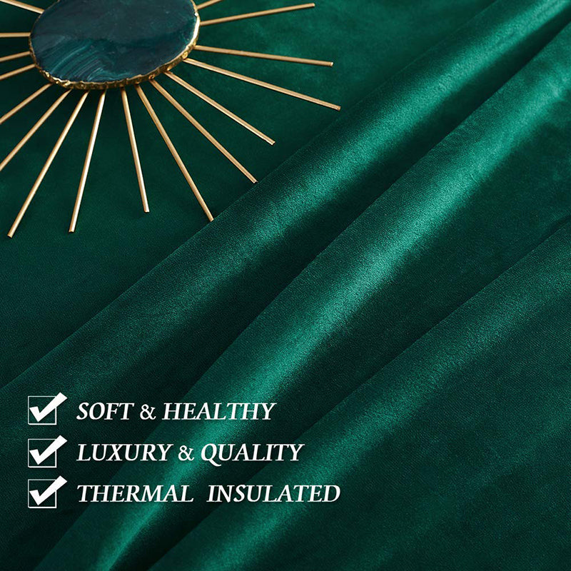 Close-up of deep green velvet rod pocket curtains, highlighting soft, luxurious quality, thermal insulated, and noise-reducing blackout fabric.
