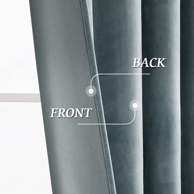 Close-up of luxurious blue velvet blackout curtain fabric, showing the plush front and thick noise-reducing back.