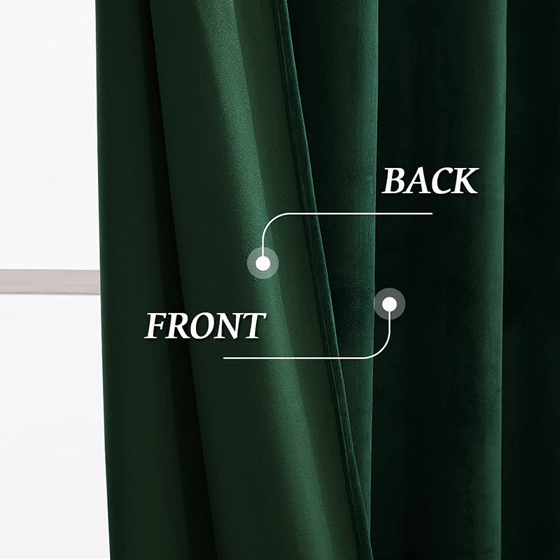 Close-up of rich dark green velvet blackout curtains, showing thick fabric's front & back for noise reduction & luxury.