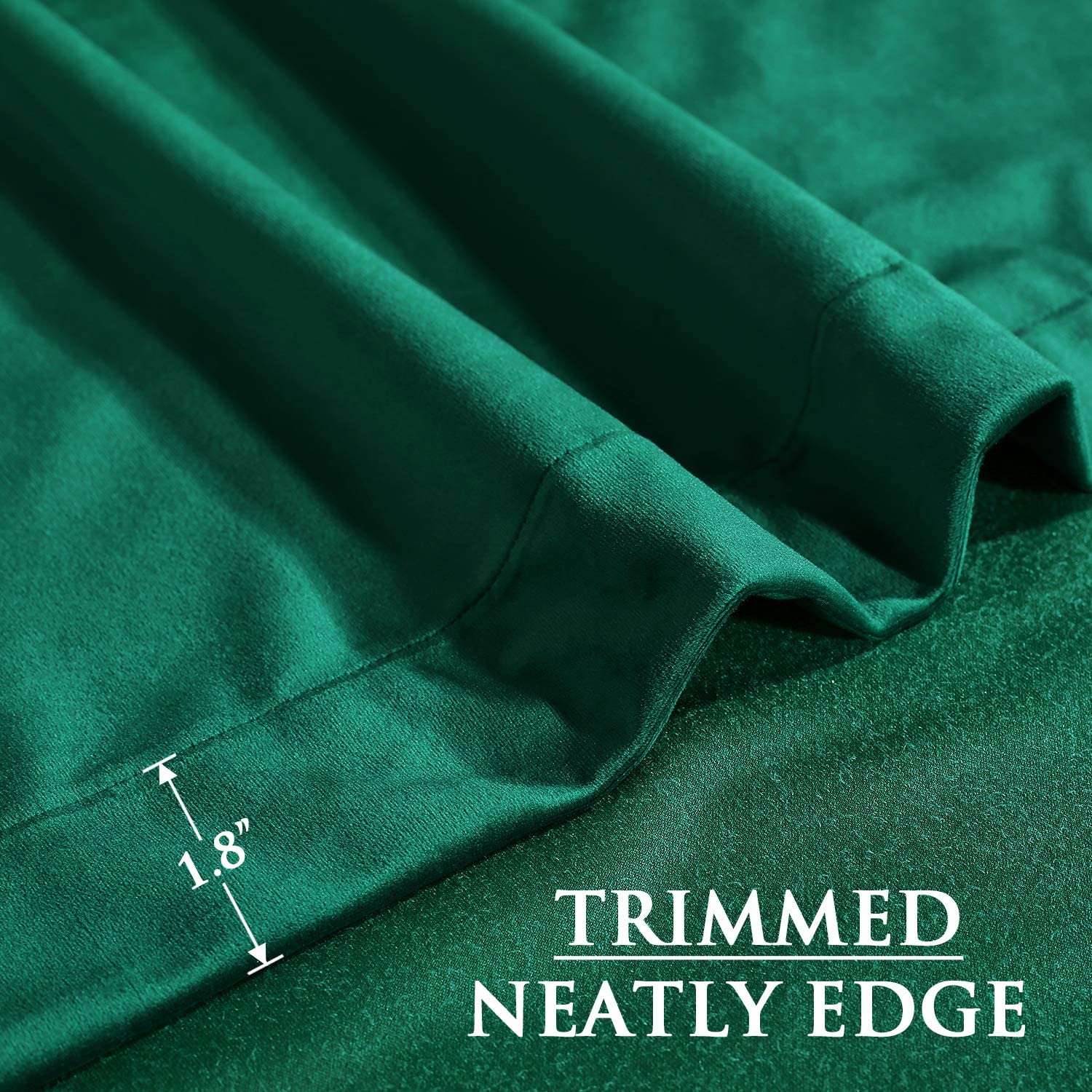 Close-up of a dark green luxury blackout velvet curtain, showcasing the neatly trimmed 1.8-inch bottom hem for a refined look.