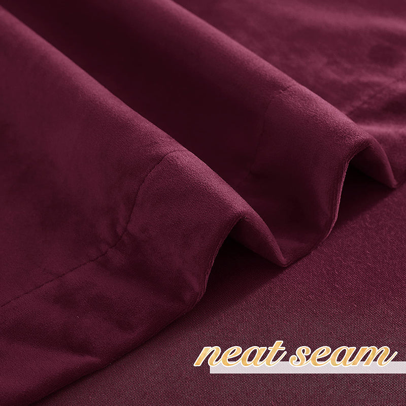 Close-up of a rich burgundy velvet blackout curtain fabric, showcasing soft texture, neat seam, and privacy protection.
