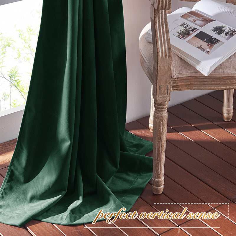 Lush dark green velvet rod pocket blackout curtain panel drapes elegantly, providing privacy for living room or bedroom.