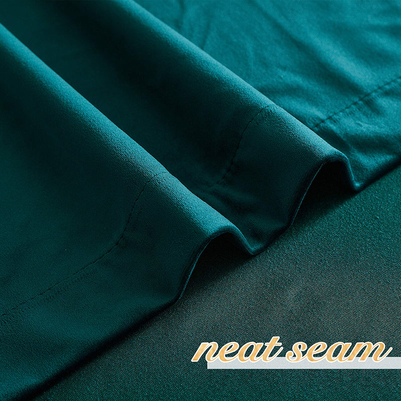 Close-up of dark green velvet blackout curtain fabric, highlighting its neat seam and soft, luxurious texture. Enhances living room & bedroom privacy.