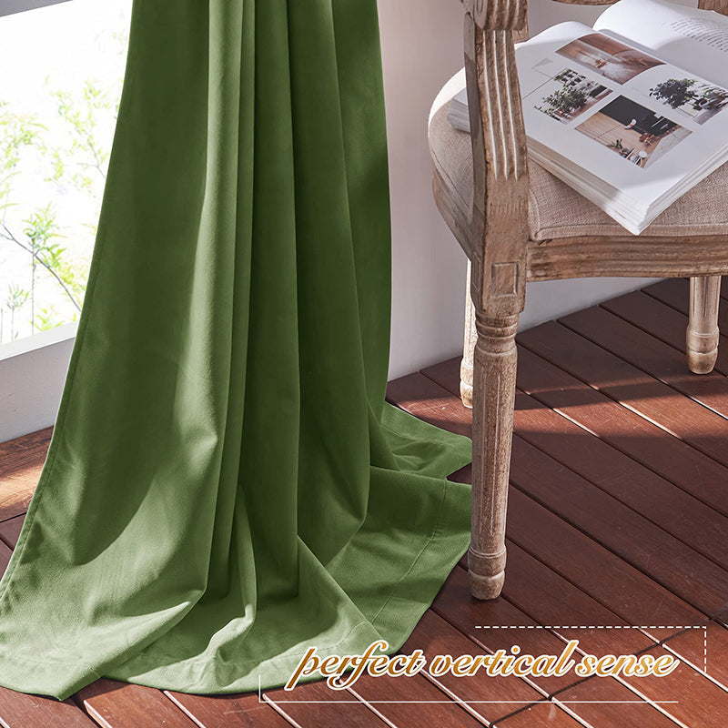 Luxurious green velvet rod pocket blackout curtain panel drapes elegantly, offering privacy and light blocking for a stylish living room or bedroom.