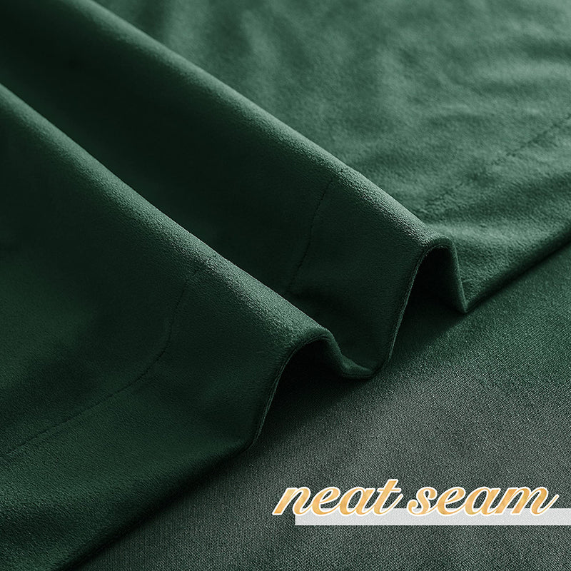 Close-up of dark green velvet blackout curtain fabric with a neat seam, highlighting the soft texture for living room & bedroom privacy.