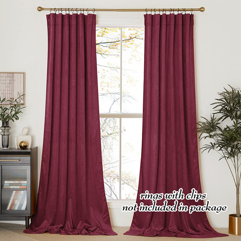 Plush burgundy velvet blackout curtains, two panels, providing privacy for living room or bedroom windows.