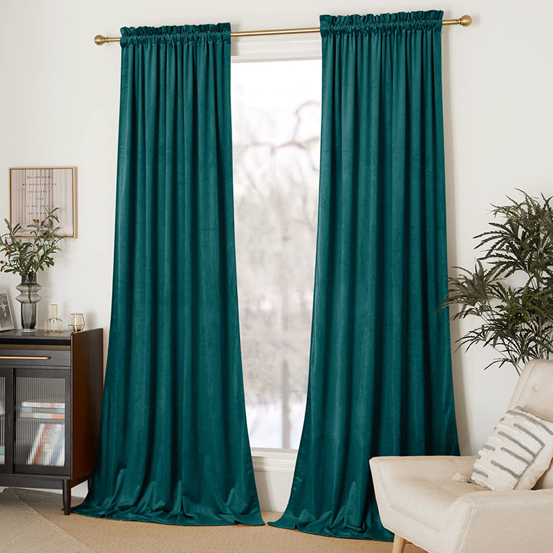 Deep teal velvet rod pocket blackout curtains (2 panels) providing privacy and light control in a stylish living room.
