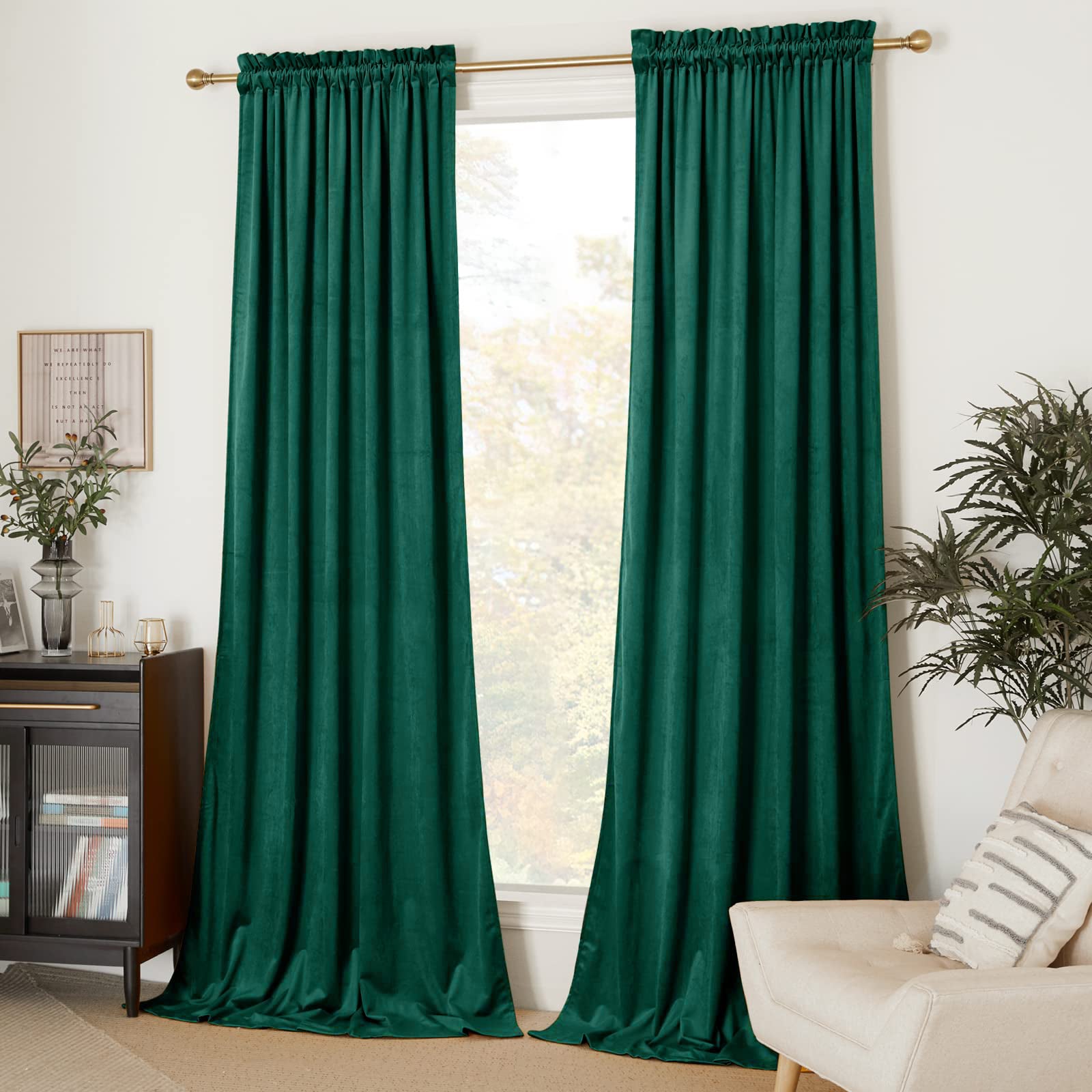 Two deep green velvet rod pocket blackout curtains offer privacy for living room or bedroom window.