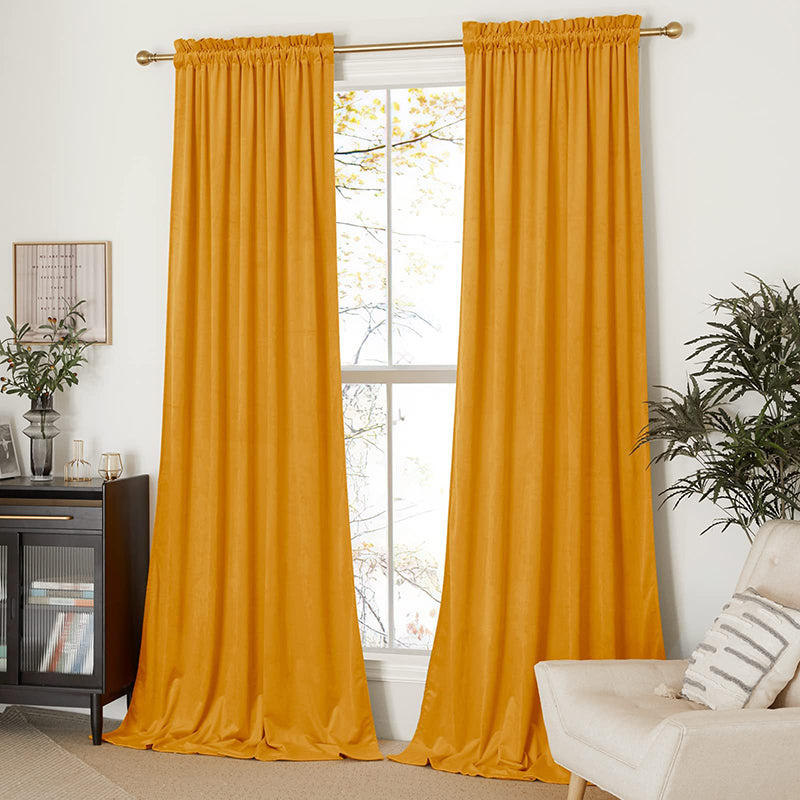 Mustard yellow velvet rod pocket blackout curtains, 2 panels, provide privacy protection for living room or bedroom windows.