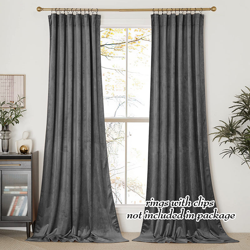 Two charcoal grey velvet rod pocket blackout curtain panels for living room or bedroom privacy and light control.